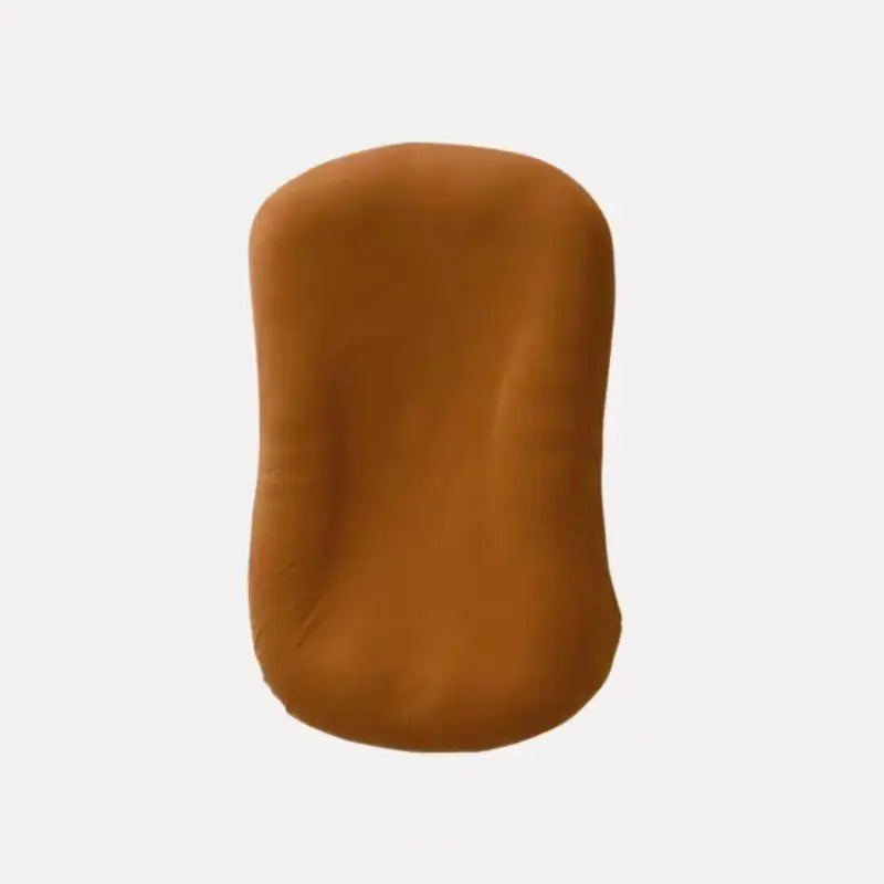 Brown portable bionic baby bed for newborns. Brown breathable cotton baby nest lounger.