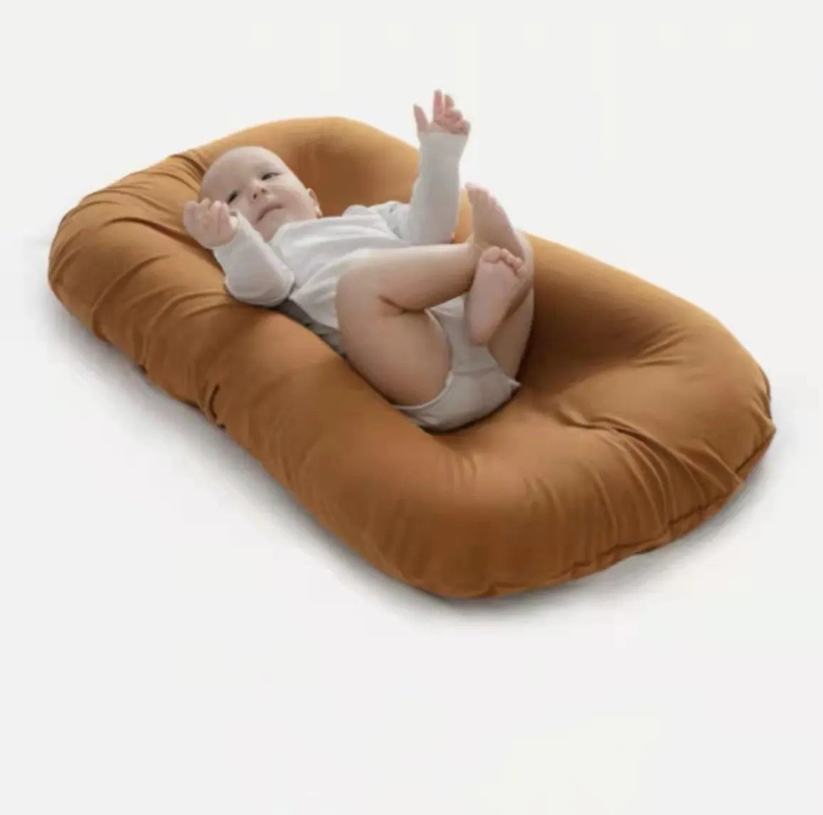 Brown portable bionic baby bed for newborns. Brown breathable cotton baby nest lounger.