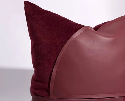 Lifestyle shot showcasing the red cushion as a focal point on a neutral-toned luxury sofa.